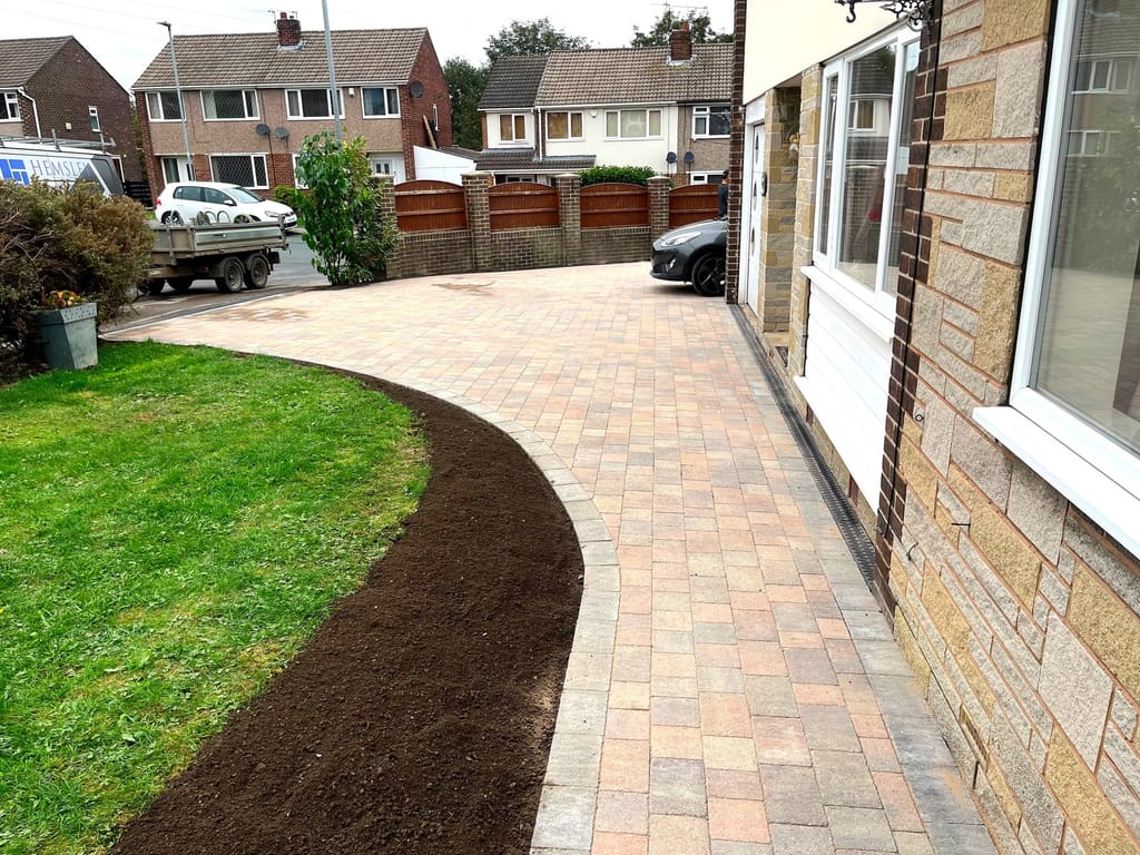 Block paved driveway completed at a stone bungalow with the Hemsley Building Services van in the street